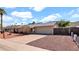 This property has a spacious driveway, two car garage, and low maintenance landscaping, ideal for convenient suburban living at 1633 W Andorra Dr, Phoenix, AZ 85029