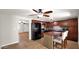 Well-equipped kitchen featuring a central island, dark wood cabinets, and modern appliances at 1633 W Andorra Dr, Phoenix, AZ 85029