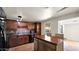 Well-appointed kitchen boasts dark wood cabinetry, tile floors, and an island with seating is great for Gathering gatherings at 1633 W Andorra Dr, Phoenix, AZ 85029