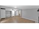 Bright living room features tiled floors, fresh neutral paint, and white cabinets perfect for storage at 1633 W Andorra Dr, Phoenix, AZ 85029