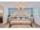 Bright bedroom featuring neutral tones, ample natural light, and elegant contemporary furnishings at 16694 W Audrey Ln, Surprise, AZ 85387