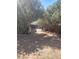 Fenced backyard area with natural landscaping, grill, and gravel at 1785 S Morrison Ln, Gilbert, AZ 85295