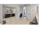 Bathroom featuring tile floors, large vanity, linen closet, and shower at 1785 S Morrison Ln, Gilbert, AZ 85295