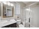 Bright bathroom with a vanity, framed mirror, shower, and toilet at 1785 S Morrison Ln, Gilbert, AZ 85295