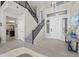 Bright foyer featuring a staircase, high ceilings, and tile flooring throughout at 1785 S Morrison Ln, Gilbert, AZ 85295