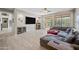 Spacious Gathering room with wood-style tile flooring and a large sliding glass door to the yard at 1785 S Morrison Ln, Gilbert, AZ 85295
