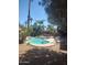 Backyard pool and spa surrounded by lush landscaping and a patio area at 1785 S Morrison Ln, Gilbert, AZ 85295