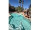 Sparkling pool with tropical landscaping and a soothing waterfall feature at 1785 S Morrison Ln, Gilbert, AZ 85295