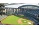 Aerial view of an empty baseball field on a sunny day, highlighting the green field and stadium seating at 2323 N Central Ave # Ph-C, Phoenix, AZ 85004