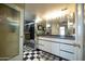 Sleek bathroom featuring modern fixtures, dual sinks, and a glass-enclosed shower, providing a spa-like experience at 2323 N Central Ave # Ph-C, Phoenix, AZ 85004