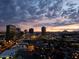 Nighttime cityscape panorama featuring illuminated buildings and streetlights against a twilight sky at 2323 N Central Ave # Ph-C, Phoenix, AZ 85004
