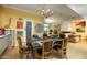 Stylish dining area with chandelier and art-filled walls, adjacent to living space at 2323 N Central Ave # Ph-C, Phoenix, AZ 85004