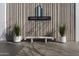 Building entrance with plants and a bench under the 'Regency on Central' sign at 2323 N Central Ave # Ph-C, Phoenix, AZ 85004