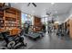 Large gym featuring an exercise bike, treadmills, and floor-to-ceiling bookshelves at 2323 N Central Ave # Ph-C, Phoenix, AZ 85004