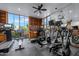 Spacious gym with treadmills, elliptical machines, and floor-to-ceiling bookshelves at 2323 N Central Ave # Ph-C, Phoenix, AZ 85004