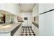 Galley kitchen featuring plenty of storage with white cabinets and dark countertops at 2323 N Central Ave # Ph-C, Phoenix, AZ 85004