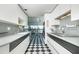 Modern kitchen featuring black and white tile, sleek countertops, and city views at 2323 N Central Ave # Ph-C, Phoenix, AZ 85004