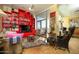 Modern living room showcasing vibrant red built-ins, unique decor, and eclectic furniture at 2323 N Central Ave # Ph-C, Phoenix, AZ 85004