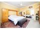 Bedroom with carpet flooring, natural light, a ceiling fan, and direct access to closets at 2323 N Central Ave # Ph-C, Phoenix, AZ 85004