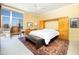 Bedroom with great natural light offering city views, carpet flooring, and a ceiling fan at 2323 N Central Ave # Ph-C, Phoenix, AZ 85004