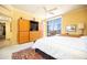 Bedroom with great natural light offering city views, carpet flooring, and a ceiling fan at 2323 N Central Ave # Ph-C, Phoenix, AZ 85004