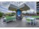 Inviting outdoor pool area with ample seating, greenery, and grill at 2323 N Central Ave # Ph-C, Phoenix, AZ 85004