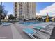 Beautiful community pool with lounge chairs and high-rise in the background at 2323 N Central Ave # Ph-C, Phoenix, AZ 85004