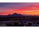 Stunning twilight skyline view of city buildings, lit up against the pink and purple hues of the sunset sky at 2323 N Central Ave # Ph-C, Phoenix, AZ 85004