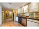 Well-appointed wet bar featuring wine storage, cabinetry, and elegant design at 2323 N Central Ave # Ph-C, Phoenix, AZ 85004