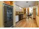 Convenient wet bar with wine fridge, glassware storage, and stylish countertops at 2323 N Central Ave # Ph-C, Phoenix, AZ 85004