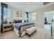 Serene main bedroom with plush carpet, and large windows dressed in blue curtains at 24973 N 174Th Ave, Surprise, AZ 85387