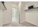 Spacious walk-in closet with carpet and shelving, providing ample storage and organization options at 24973 N 174Th Ave, Surprise, AZ 85387