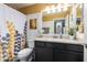 Bathroom featuring a vanity with a gray countertop and a yellow and gray shower curtain at 25844 W Watkins St, Buckeye, AZ 85326