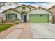 Charming single-Gathering home with a two-car garage, manicured lawn, and inviting curb appeal at 25844 W Watkins St, Buckeye, AZ 85326