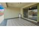 Spacious covered patio with mosaic tile design that leads to a backyard with desert landscaping at 25844 W Watkins St, Buckeye, AZ 85326