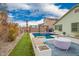 Backyard featuring a pool with deck and desert landscaping, complete with a shaded pergola area at 25844 W Watkins St, Buckeye, AZ 85326