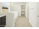 Bright bathroom with dual sinks, tub, and walk-in closet at 2639 E Santa Ynez Dr, Casa Grande, AZ 85194