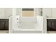 Modern bathroom with a deep soaking tub nestled between two vanities and white tile at 2639 E Santa Ynez Dr, Casa Grande, AZ 85194