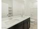 Modern bathroom with dual sinks, white countertops and dark cabinets at 2639 E Santa Ynez Dr, Casa Grande, AZ 85194