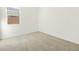 Cozy bedroom with carpet flooring, white walls, and a window providing natural light at 2639 E Santa Ynez Dr, Casa Grande, AZ 85194