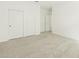 Clean bedroom featuring neutral carpet, white walls, and closet with sliding doors at 2639 E Santa Ynez Dr, Casa Grande, AZ 85194