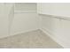 Bright walk-in closet with carpet and built-in shelves at 2639 E Santa Ynez Dr, Casa Grande, AZ 85194