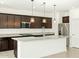 Modern kitchen with granite counters, dark cabinets, and stainless steel appliances at 2639 E Santa Ynez Dr, Casa Grande, AZ 85194