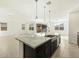 This kitchen island has granite countertops, stainless sink and modern fixtures at 2639 E Santa Ynez Dr, Casa Grande, AZ 85194