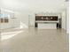 Bright, open-concept space with tiled floors connecting living, dining, and kitchen areas at 2639 E Santa Ynez Dr, Casa Grande, AZ 85194