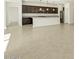 Tiled living area flows seamlessly into kitchen with island and stainless steel appliances at 2639 E Santa Ynez Dr, Casa Grande, AZ 85194