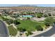 A high aerial view of the community park area with pool, splashpad, green space, and playground at 2639 E Santa Ynez Dr, Casa Grande, AZ 85194