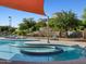 Community pool featuring a waterslide and lounge chairs along the clear blue pool area at 2639 E Santa Ynez Dr, Casa Grande, AZ 85194