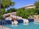 Community pool featuring a waterslide and clear blue swimming area at 2639 E Santa Ynez Dr, Casa Grande, AZ 85194