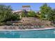 Community pool featuring a waterslide and lounge chairs along the clear blue pool area at 2639 E Santa Ynez Dr, Casa Grande, AZ 85194